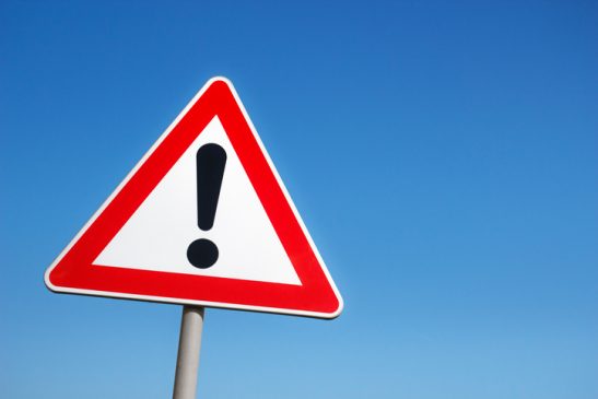 warning sign alerting investors of companies that have been added to the bcsc's investment caution list