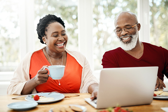 Image of a husband and wife ready for retirement and looking at how to access their retirement savings.