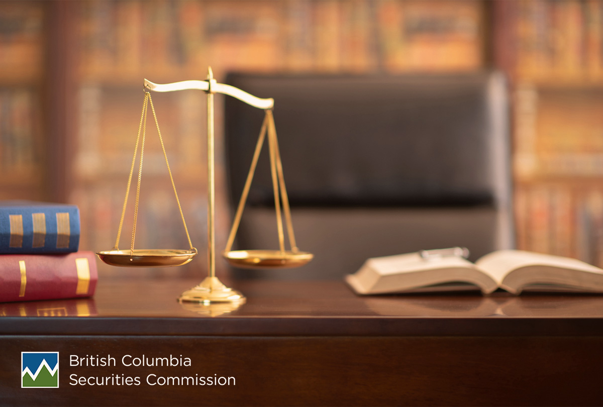 Gold scales of justice with a legal textbook in the background represents enforcement actions taken in British Columbia by the BCSC in April 2021..